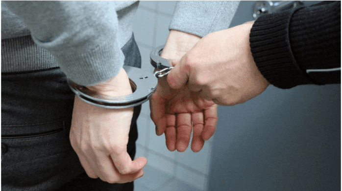 person in handcuffs