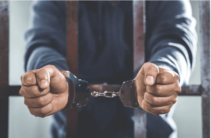 arrested and behind bars
